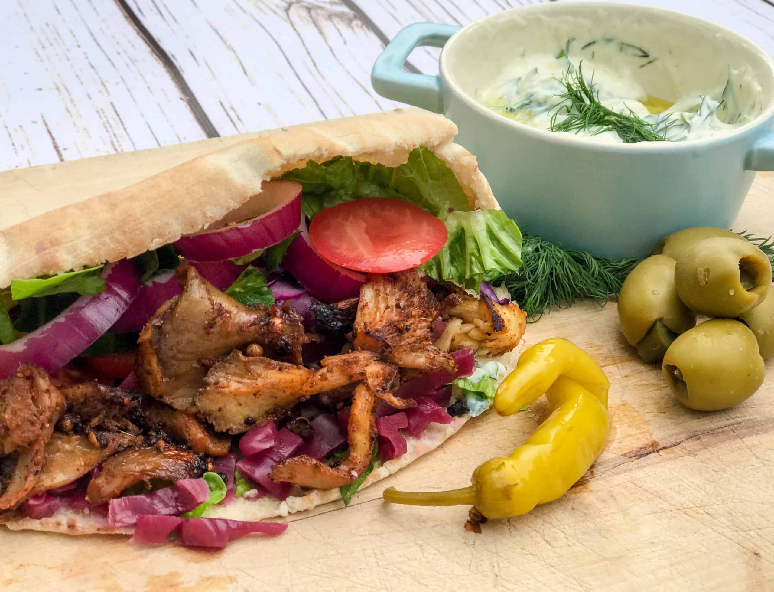 Sauteed mushrooms in a pita with red onion, tomato and lettuce.