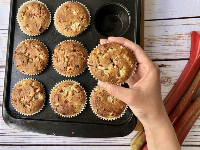 Vegan gluten-free buckwheat rhubarb muffins in a baking tray, ready to enjoy.