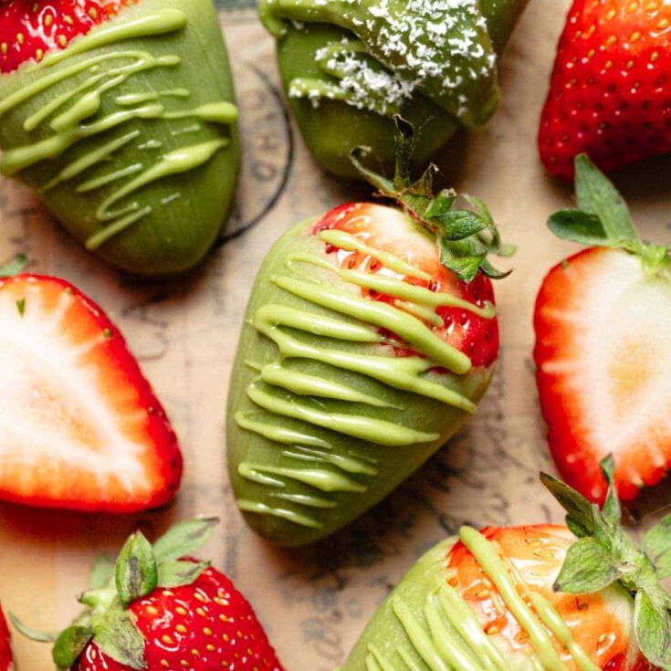 Fresh strawberries dipped in vibrant green vegan chocolate drizzle.